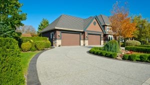 Paved Concrete Driveways Bloomington, IN Improve Appearance Durable and Smooth Vehicle Surfaces with Many Customizable Options Increase Property Value and Convenience